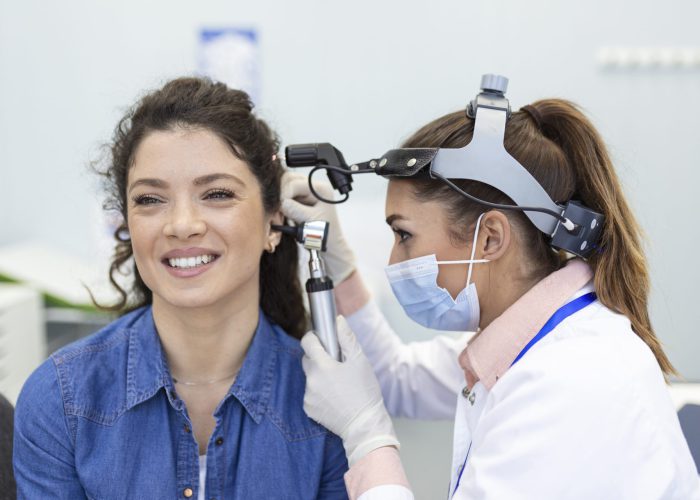 hearing-exam-otolaryngologist-doctor-checking-woman-s-ear-using-otoscope-auriscope-medical-clinic